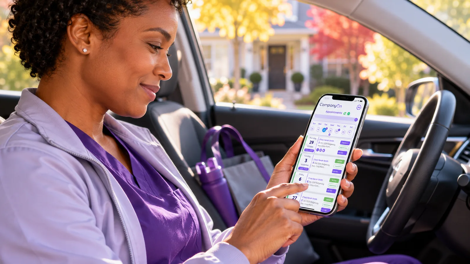 A caregiver reviewing her day of appointments in the CompanyOn mobile app from her car before the next visit